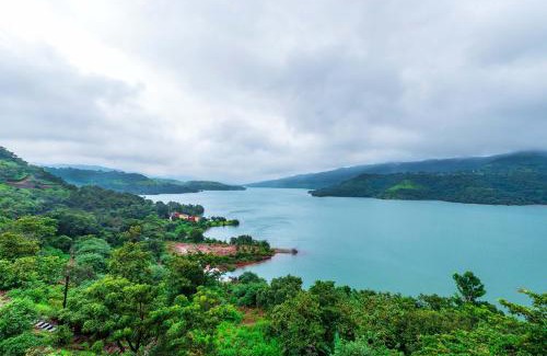 Paud Villa | SaffronStays Riverdale, Mulshi - Lakefront villa with pool and mountain view