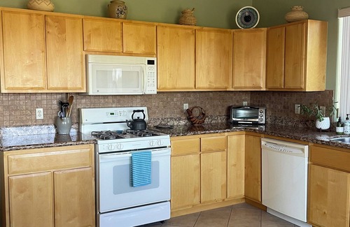 Tucson House | Saguaro Studded City and Mountain Views in the Tucson Mountain foothills.