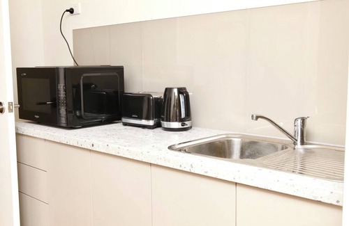 Surfside House | Salt Water Retreat, BBQ area with water views