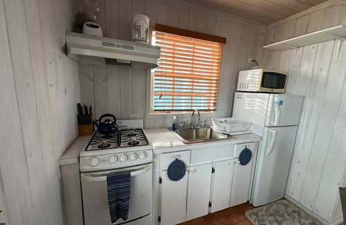 Black Point Cottage | Sand Dollar Cottage with stunning views. Near Swimming Pigs!