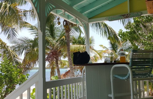 Lubbers Quarters Cay House | Sandy beachfront paradise with dock and a/c bedrooms at Green Bananas Cottage