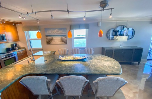 Punta Rassa Condo | Sanibel Harbour 817: Wrap-around lanai-Amazing Water Views! Enjoy private beach &activities nearby.