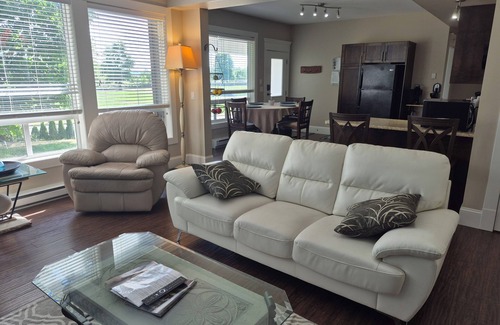 McMillan Apartment | Scenic 2 bedroom walkout suite with hot-tub and outdoor pool, across from Park.