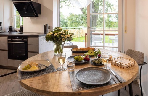 Schrozberg Apartment | Schmalfelden No. 95 with spa oasis in the living room: compact sauna, loungers and fireplace. Fenced garden with great veranda!
