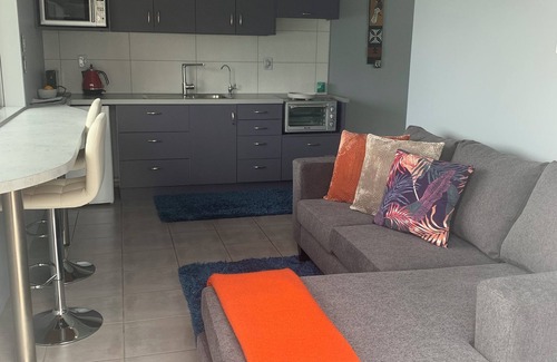 Onerahi Apartment | Sea, bush and gardens surround Mason Lane Apartment