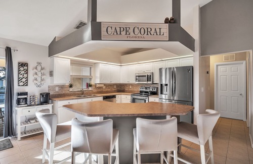 Trafalgar House | Seas the Day! Heated Pool Home on Canal 4 bedroom/2 Bath