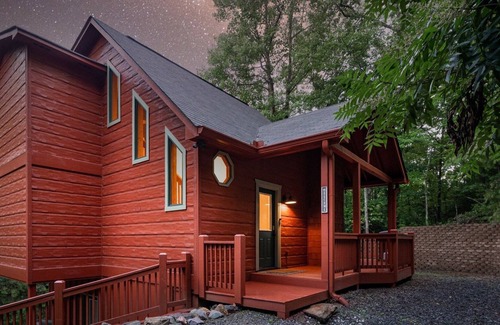 Ellijay Cabin | Secluded but Convenient Resort Cabin with Hot Tub, String Lights, and Fire Pit