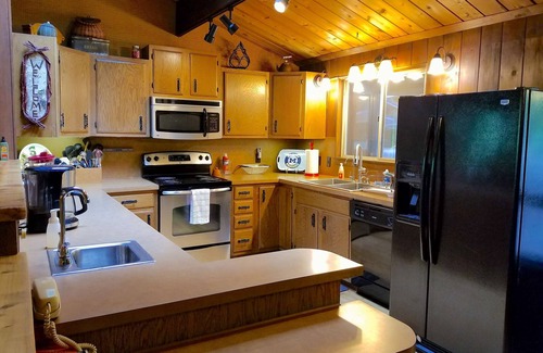 Mayfield Cottage | Secluded Cottage on the Boardman River w/Hot Tub & Fireplace