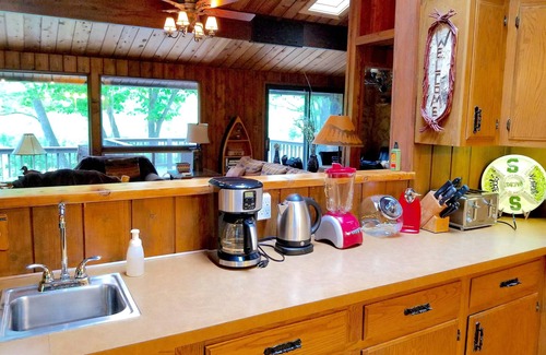 Mayfield Cottage | Secluded Cottage on the Boardman River w/Hot Tub & Fireplace