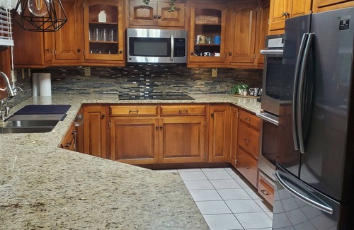 Killbuck House | Secluded peaceful family home! Large deck, patio, waterfalls, koi pond, hot tub!