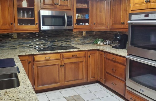 Killbuck House | Secluded peaceful family home! Large deck, patio, waterfalls, koi pond, hot tub!