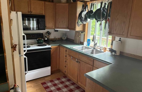 North Pole Cabin | Secluded & quiet, close to town. Stone fireplace inside & a firepit out back