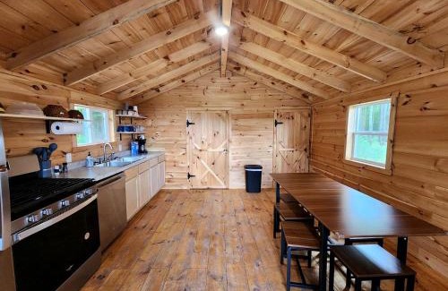 White Cloud House | Secluded Rustic Cabins with Private Pond & Trails near ORV Routes in White Cloud, Michigan
