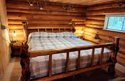 White Cloud House | Secluded Rustic Cabins with Private Pond & Trails near ORV Routes in White Cloud, Michigan