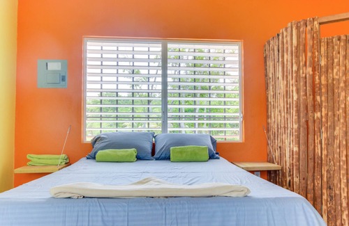 Dangriga Cabin | Secluded seaside cabana with beach access, ocean view, hammock & partial AC