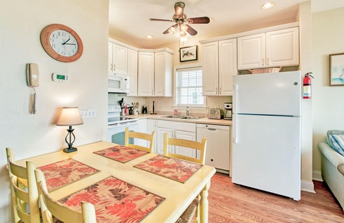 Hatteras Condo | Second-floor oceanfront home with outdoor pool, hot tub, pool table, & W/D