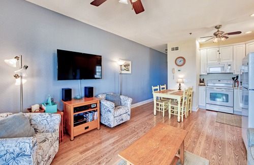 Hatteras Condo | Second-floor oceanfront home with outdoor pool, hot tub, pool table, & W/D