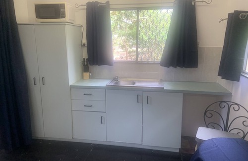 Leanyer Cabin | Self contained Cabin 5 metres from pool on 5 acres of tropical and native garden