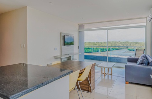 Puntarenas Condo | Serene condo with ocean views, modern amenities & pool access