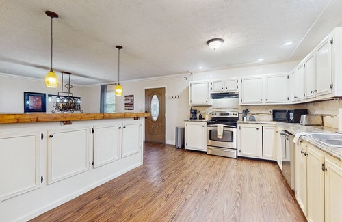 Caryville Cabin | Serene lake home with foosball, dartboard, luxe kitchen - dog friendly!