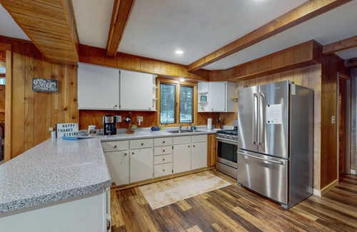 Lake Tomahawk House | Serene Lakefront Home with Fire pit, Dock, WIFI, & Dog-Friendly