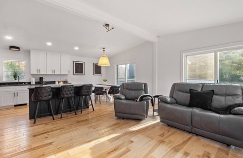 Rapid City House | Serene, Spacious Riverfront Home close to Torch Lake with lots of Entertainment