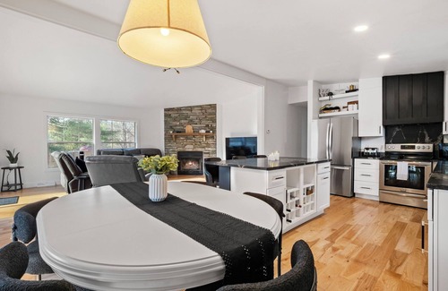 Rapid City House | Serene, Spacious Riverfront Home close to Torch Lake with lots of Entertainment