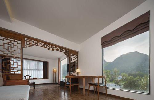 Diecai Hotel | Serene Vale Inn Railway station free pick-up by 2 nights English and Spanish reception available