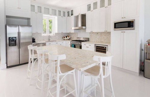 Dunmore Town House | Serene waterfront house w pool, dock & beautiful sunsets - 5 min walk to beach.