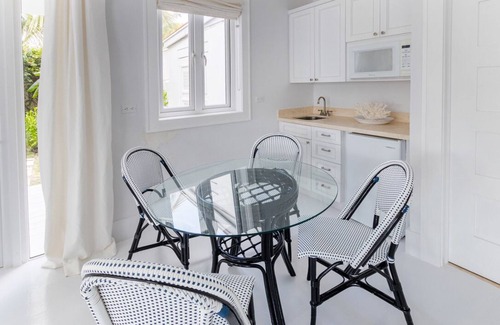 Dunmore Town House | Serene waterfront house w pool, dock & beautiful sunsets - 5 min walk to beach.
