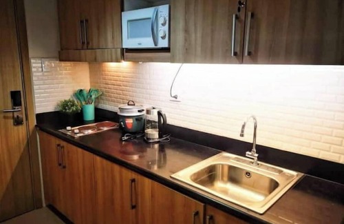Barangay 76 House | Serenity Cove MOA Cozy condo unit amenity view.
