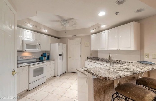 New Smyrna Beach Condo | Serenity Sands: Escape to the seaside resort of Oceanwalk in New Smyrna Beach