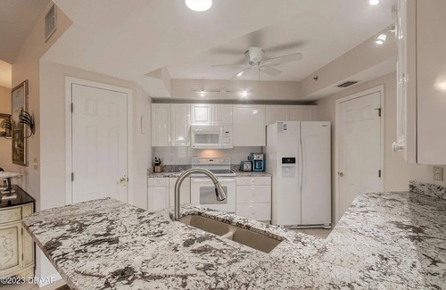 New Smyrna Beach Condo | Serenity Sands: Escape to the seaside resort of Oceanwalk in New Smyrna Beach