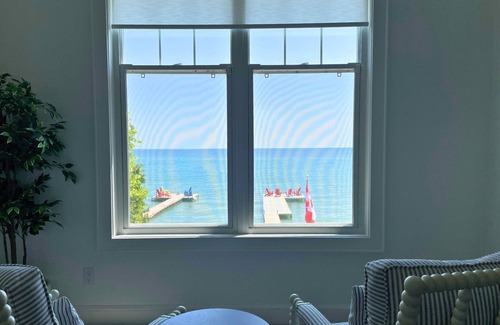 Big Bay Point Cottage | Shallow Beach Lakefront Cottage perfect with Kayak, Firepit, BBQ + Playground