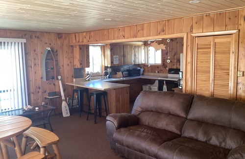 Manistique Cottage | Shoreline Oasis- Your Cozy Autumn Retreat with Beachfront Beauty