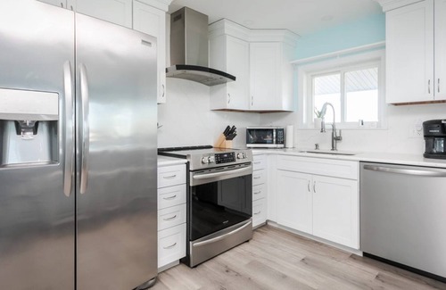 Hampton Condo | Short stroll to the beach! Newly renovated, 3 bedroom condo, wrap around porch