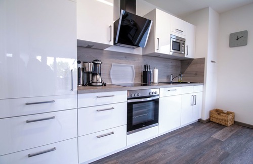 Fedderwardersiel Apartment | Sielhuus 11 Ferienwohnung mit Dachterrasse und Infrarotsauna und Kamin für bis zu 4 Personen in Fedderwardersiel!