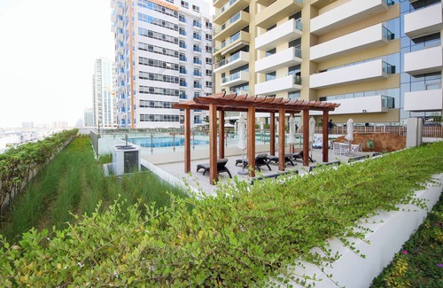 Discovery Gardens Apartment | Silk Valley - Brand new 1B with pool view