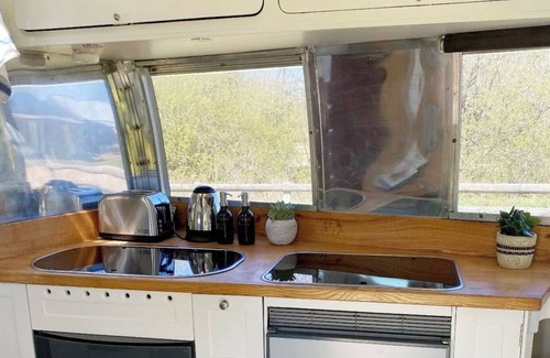 Gumley House | Silverbird Glamping Airstream Caravan and private deck