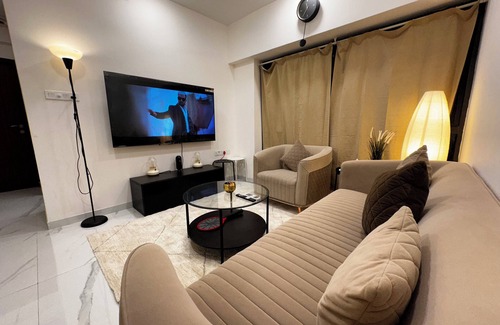 Goregaon West Apartment | Sky Oasis: Premium 2BHK I 65' TV, AC, High Floor, Andheri West