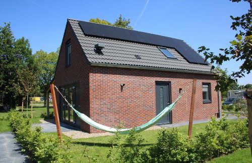 Sint Maarten House | Slapen tussen de duinen by Droomvilla