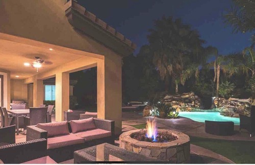 Orchards House | Sleek 4121 sq ft estate with a heated waterfall pool with a slide