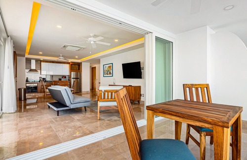 Mismaloya Condo | Sleek 9th-floor condo with wraparound balcony, ocean views & pool