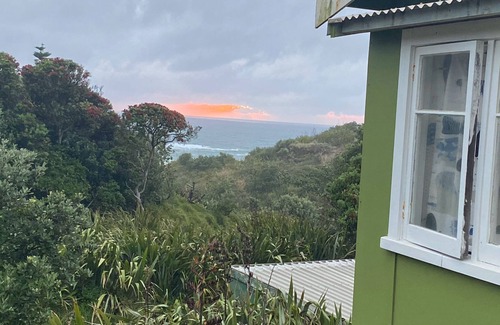 Baylys Beach Cabin | Small Traditional Family Bach within walking distance to beach.