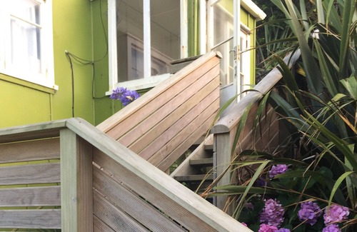 Baylys Beach Cabin | Small Traditional Family Bach within walking distance to beach.
