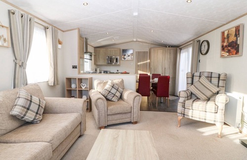 St George Cottage | SNAPE LODGE, pet friendly, with pool in Towyn