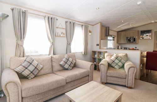 St George Cottage | SNAPE LODGE, pet friendly, with pool in Towyn
