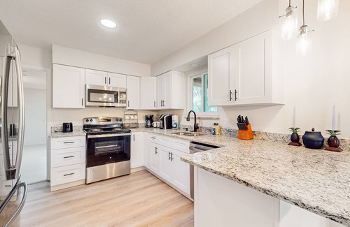 Palm Bay House | Snowbird-friendly home with open layout, enclosed yard, smart TV, AC, & W/D