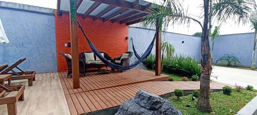 Muquem House | Sobrado com 3 Suítes, Piscina, Sala de Jogos, Playground, Garagem para 4 Carros