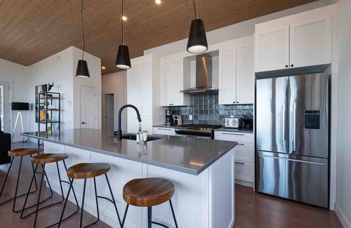 Les Eboulements Ski Chalet | Solstice 203: Luxury Living, Riverfront Serenity